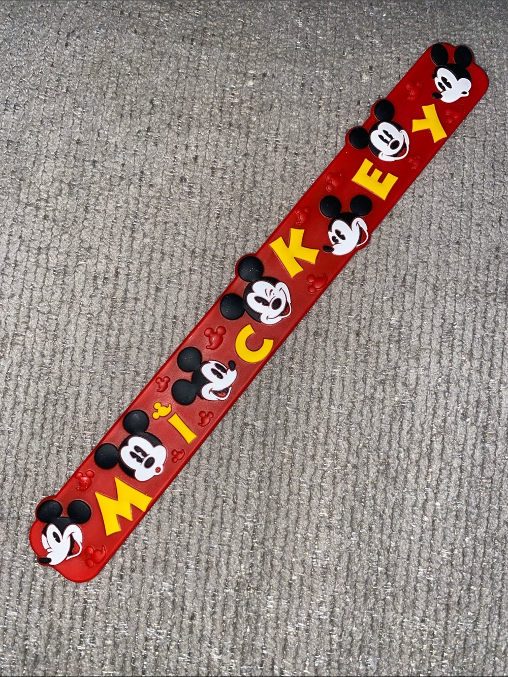 Mickey Mouse slap bracelet distributed by Disney theme park merchandise